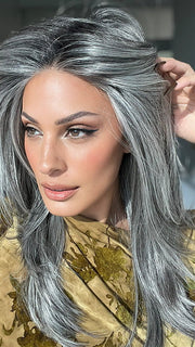 Model is wearing MIRROR MOMENT by GABOR in color GF44-60SS SUGARED LICORICE | Salt Dark Brown with Subtle Warm Highlights Roots