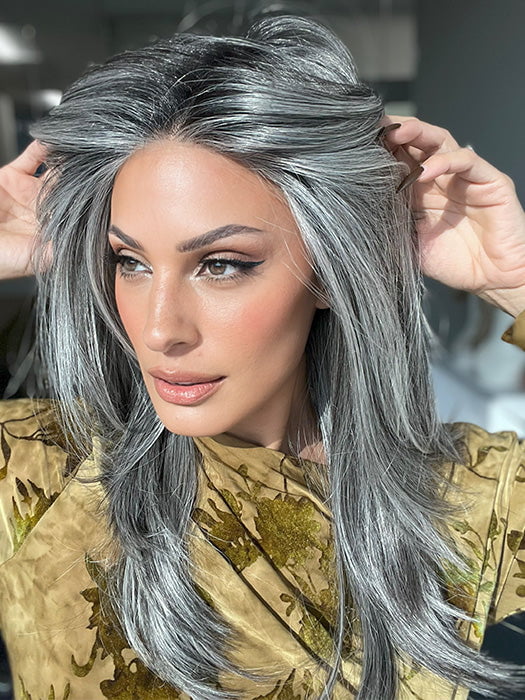 Model is wearing MIRROR MOMENT by GABOR in color GF44-60SS SUGARED LICORICE | Salt Dark Brown with Subtle Warm Highlights Roots