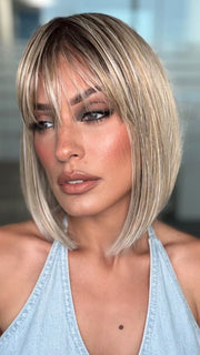Roxie is wearing MISS COMFORT by ELLEN WILLE in PEARL BLONDE ROOTED 101.24.20 | Pearl Platinum, Lightest Ash Blonde and Light Strawberry Blonde Blend with Dark Shaded RootsShaded Roots