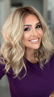 Crystal @crystallhoneycutt wearing MOLLY by ENVY in color SPARKLING CHAMPAGNE | Medium Brown roots with overall Strawberry Blonde base and soft Golden Blonde highlights