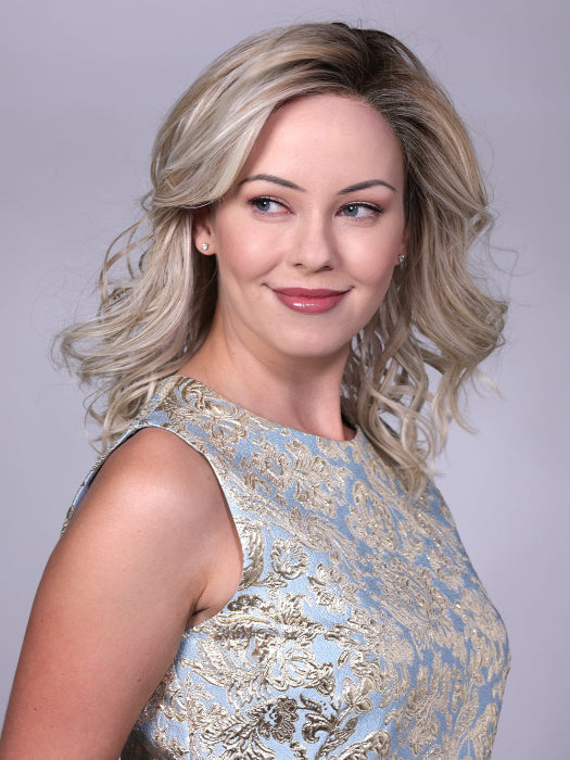 Model is wearing MORGAN By BELLETRESS in CRUSHED-ALMOND-BLONDE-R | A Soft Neutral Light Blonde with a Light and Medium Blended Root Color