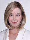 Model is wearing ROMA by BELLETRESS in color RAW-SUGAR-BLONDE-R | A Neutral Light Blonde, Honey Blonde, Pale Gold Blonde, with a base of Light Brown Lowlights featuring a Medium Root Color