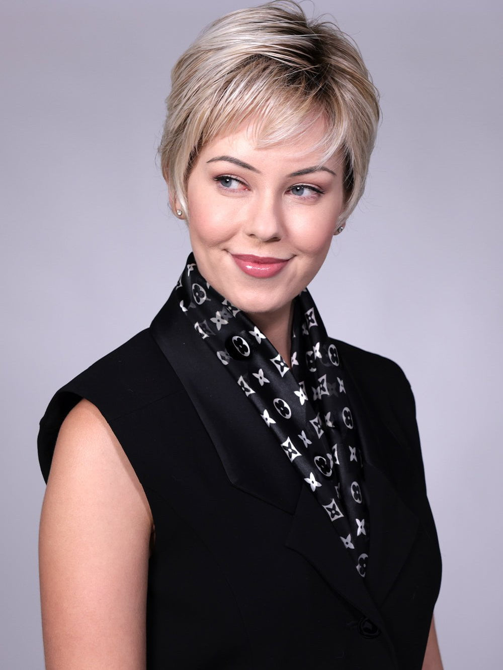 Model is wearing Gramercy in CRUSHED ALMOND BLONDE R | A soft Neutral Light Blonde with a Light and Medium Blended Root Color