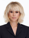 Model is wearing NEW WAVE by TRESSALLURE in color 24/102/R12 | Gold Blonde with Platinum highlights with Gold Brown roots