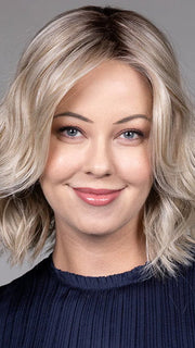 Model is wearing OLIVIA in color BUTTERBEER R | Dark Brown Base and Root that transitions smoothly into a buttery blonde, infused with creamy honey and toffee tones