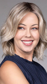 Model is wearing OLIVIA in color BUTTERBEER R | Dark Brown Base and Root that transitions smoothly into a buttery blonde, infused with creamy honey and toffee tones