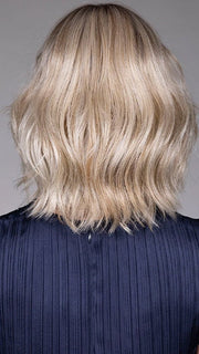 Model is wearing OLIVIA in color BUTTERBEER R | Dark Brown Base and Root that transitions smoothly into a buttery blonde, infused with creamy honey and toffee tones