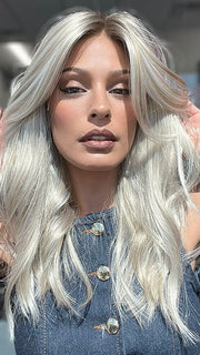 Model is wearing OLIVIA by JON RENAU in color FS17/101S18 PALM SPRINGS BLONDE | Light Ash Blonde with Pure White Natural Violet Bold Highlights, Shaded with Dark Natural Ash Blonde