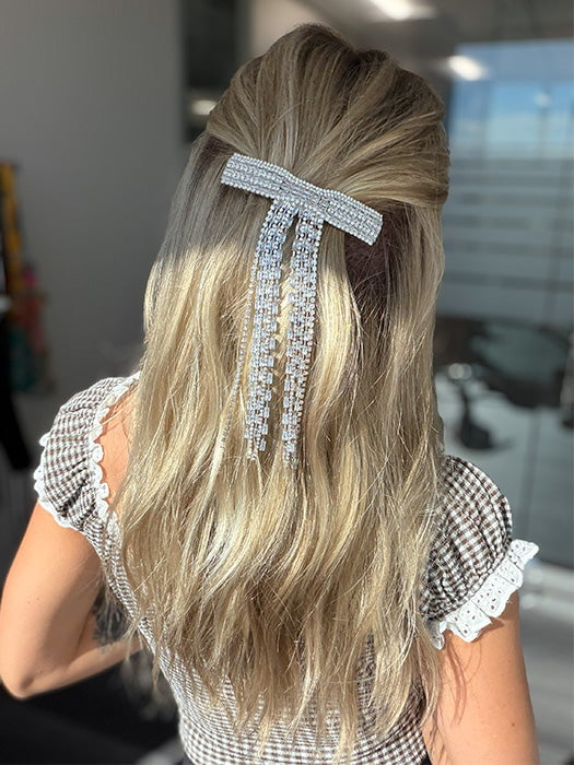 Model is wearing OLIVIA by JON RENAU in color 22F16S8 VENICE BLONDE | Light Ash Blonde and Light Natural Blonde Blend Shaded with Medium Brown (styled with clip - not included)