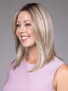 Model is wearing PIANA in color BUTTERBEER |  A rich blend of warm brunette and golden honey highlights finished with a soft, natural root.