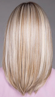 Model is wearing PIANA in color BUTTERBEER |  A rich blend of warm brunette and golden honey highlights finished with a soft, natural root.