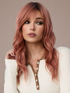Model is wearing POSH WAVEZ in DUSTY ROSE | Medium Coral Red Base with Dark Brown Roots