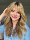 Sandy @i_be_wiggin wearing POSH WAVEZ by RENE OF PARIS in color Bronzed Honey-R | A perfect blend of rich, warm golden blond and medium chocolate brown tones, complemented by a dark chocolate root that adds a luxurious, dimensional effect.