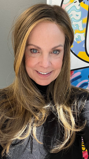 Susan Sparks @sparkles_intheworld wearing MIRAGE by ELLEN WILLE in color MOCCA-ROOTED 830.27.12 | Medium Brown, Light Brown, and Light Auburn Blend with Dark Roots