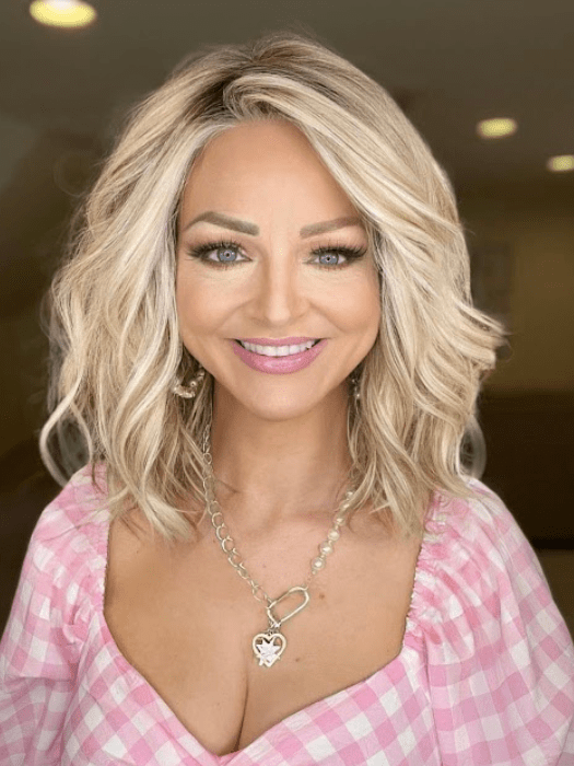 Sandy @i_be_wiggin wearing WAVY DAY by RAQUEL WELCH WIGS in color RL19/23SS SHADED BISCUIT | Light Ash Blonde Evenly Blended with Cool Platinum Blonde with Dark Roots