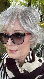 Mel B. @mels.be.ageless wearing VOLTAGE ELITE by RAQUEL WELCH WIGS in color RL51/61 ICED GRANITA | Lightest Grey Progresses to a Deep Grey at the Nape
