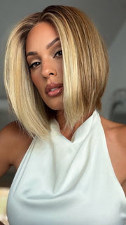 Roxie wearing EURO CHIC by TRESSALLURE in EL12/22/8 | Light Golden Brown Evenly Blended with Platinum Blonde Highlights with Medium Brown Roots