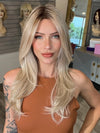 Madeline wearing SPEARS by BELLETRESS in MILKSHAKE BLONDE R | A mixture of Light Sandy Brown, Highlighted with Light Ash Blonde with a Hint of Light Platinum Blonde with a Medium Root Color