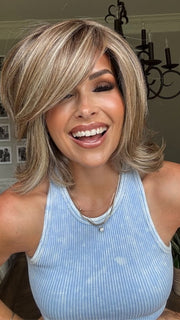 Crystal wearing UPSTAGE by RAQUEL WELCH in RL12/22SS SHADED CAPPUCCINO | Light Golden Brown Evenly Blended with Cool Platinum Blonde Highlights with Dark Roots