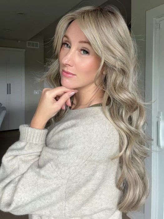Carly wearing CAROLINA by BELLETRESS in SPARKLING CHAMPAGNE R | Medium Ash Brown roots transition into Shimmering Champagne Blonde characterized by Pale Golden Hues with subtle Ivory and Platinum undertones reminiscent of a sparkling glass of bubbly