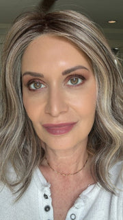 Emily wearing SIMMER ELITE PETITE by RAQUEL WELCH in RL12/22SS SHADED CAPPUCCINO | Light Golden Brown Evenly Blended with Cool Platinum Blonde Highlights with Dark Roots