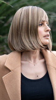 Roxie wearing PAIGE PETITE by ENVY in TOASTED SESAME | Medium Brown roots with overall Warm Cinnamon base and Golden Blonde highlights