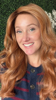 Carly wearing WITHERSPOON by BELLETRESS in MIXED BERRY R | A bold, berry-inspired red with deep auburn tones and soft rooting for a natural regrowth effect. 