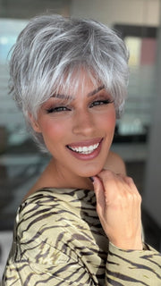 Roxie wearing VOLTAGE PETITE by RAQUEL WELCH in R56/60 SILVER MIST | Lightest Grey Evenly Blended with Pure White