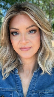 Sandy wearing BRADSHAW by BELLETRESS in BUTTERCAKE BLONDE-R | A neutral-warm blonde blend featuring light brown, ash, and lightest blonde tones with natural-looking darker roots for added depth and realism.