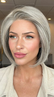 Madeline wearing STRAIGHT UP WITH A TWIST by RAQUEL WELCH in RL119 SILVER AND SMOKE | Light Brown with 80% Gray in Front Gradually into 50% Gray Towards the Nape 