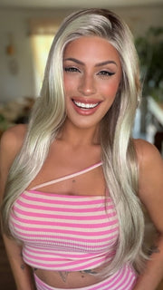 Roxie wearing AVERY by JON RENAU in 101/88/27S8 CATALINA BLONDE | Pale blonde with Pure White Natural Violet halo highlights, shaded medium brown