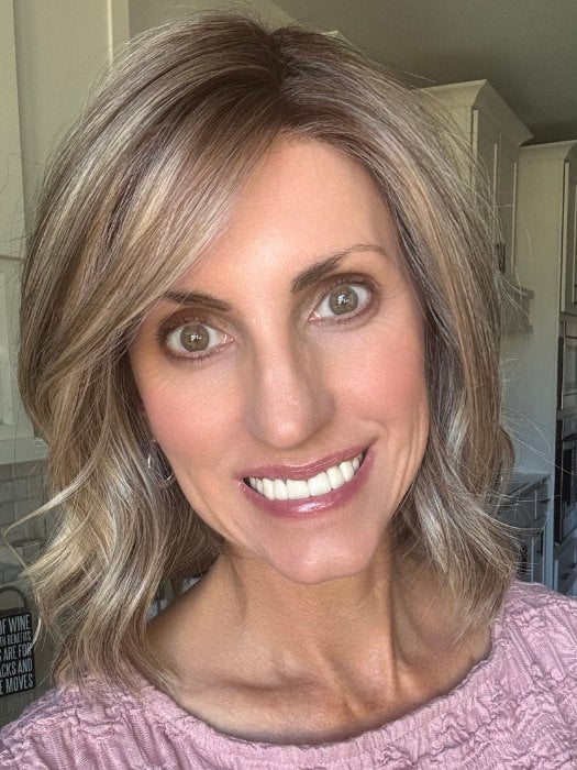 Lisa wearing BERRY by BELLETRESS in SPARKLING CHAMPAGNE BLONDE R | A radiant blend of champagne blonde with soft golden and beige tones, grounded by natural-looking roots in ash brown and dark blonde.