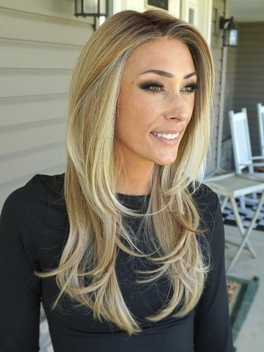 Nichole wearing KATNISS by BELLETRESS in BUTTERCAKE BLONDE-R | A neutral-warm blonde blend featuring light brown, ash, and lightest blonde tones with natural-looking darker roots for added depth and realism.