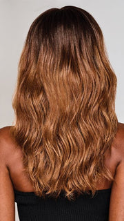 RL2/31OM | Black blend from the roots to midlength that transition into a medium light auburn ombré from midlength to the ends