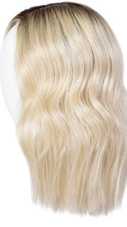 A stunning shoulder-length wig with soft tumbled waves