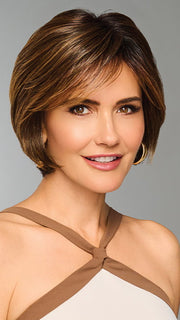 Model is wearing EFFORTLESS STYLE by RAQUEL WELCH in color RL8/29SS SHADED HAZELNUT | Warm Medium Brown Evenly Blended with Ginger Blonde with Dark Roots
