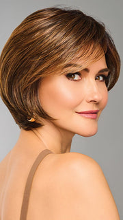 Model is wearing EFFORTLESS STYLE by RAQUEL WELCH in color RL8/29SS SHADED HAZELNUT | Warm Medium Brown Evenly Blended with Ginger Blonde with Dark Roots