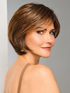 Model is wearing EFFORTLESS STYLE by RAQUEL WELCH in color RL8/29SS SHADED HAZELNUT | Warm Medium Brown Evenly Blended with Ginger Blonde with Dark Roots