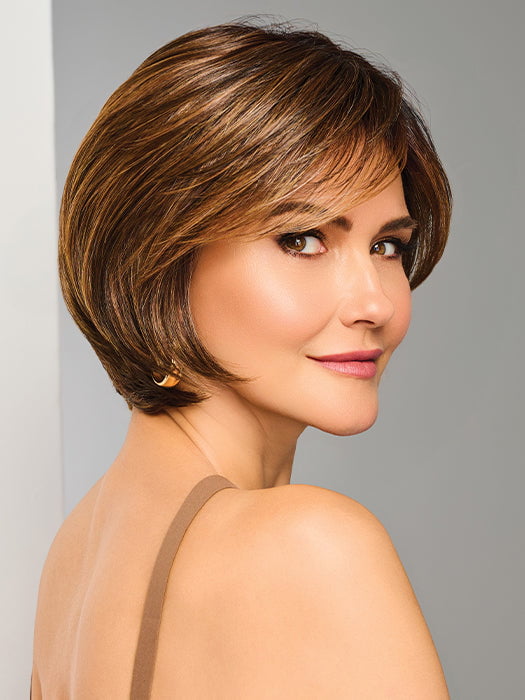 Model is wearing EFFORTLESS STYLE by RAQUEL WELCH in color RL8/29SS SHADED HAZELNUT | Warm Medium Brown Evenly Blended with Ginger Blonde with Dark Roots