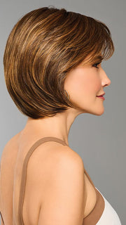 Model is wearing EFFORTLESS STYLE by RAQUEL WELCH in color RL8/29SS SHADED HAZELNUT | Warm Medium Brown Evenly Blended with Ginger Blonde with Dark Roots