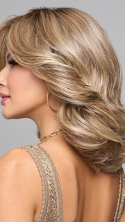 This layered hairstyle has feathery edges and forms V-shape at back