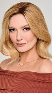A Remy human hair topper with a reinforced thin edge and hand tied monofilament base for a seamless blend and “barely there” feel