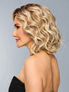 Model is wearing ROMANTIC RENAISSANCE in color RL19/23SS SHADED BISCUIT | Light Ash Blonde Evenly Blended with Cool Platinum Blonde and Dark Roots