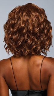 Model is wearing ROMANTIC RENAISSANCE in color RL32/31 CINNABAR | Medium Dark Auburn Evenly Blended with Medium Light Auburn