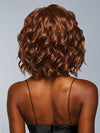 Model is wearing ROMANTIC RENAISSANCE in color RL32/31 CINNABAR | Medium Dark Auburn Evenly Blended with Medium Light Auburn