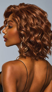 Model is wearing ROMANTIC RENAISSANCE in color RL32/31 CINNABAR | Medium Dark Auburn Evenly Blended with Medium Light Auburn
