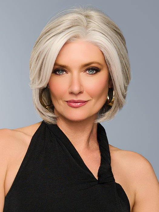 Model is wearing TAILORED ALLURE in color L51/61 ICED GRANITA | Lightest Grey Progresses to a Deep Grey at the Nape