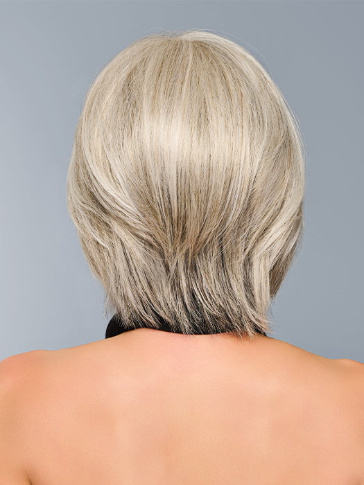 Model is wearing TAILORED ALLURE in color L51/61 ICED GRANITA | Lightest Grey Progresses to a Deep Grey at the Nape