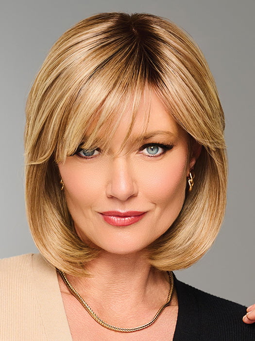 Model is wearing TIMELESS CHARM by RAQUEL WELCH in color  RL14/22SS SHADED WHEAT | Dark Blonde Evenly Blended with Platinum Blonde with Dark Roots