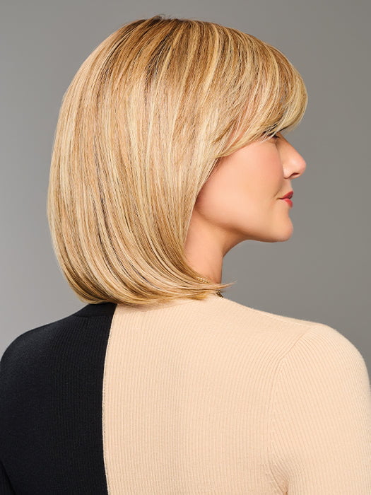 Model is wearing TIMELESS CHARM by RAQUEL WELCH in color  RL14/22SS SHADED WHEAT | Dark Blonde Evenly Blended with Platinum Blonde with Dark Roots
